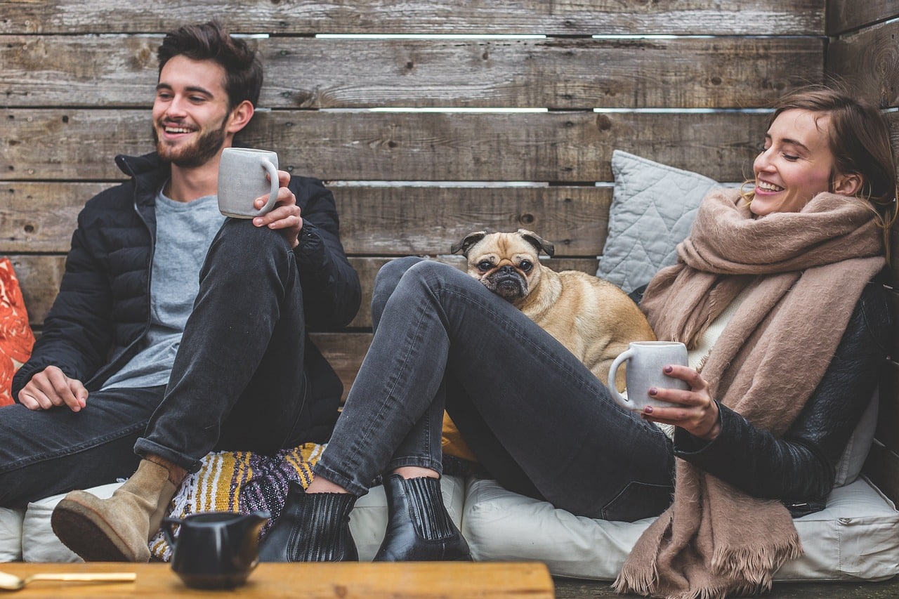 man, woman, dog, coffee