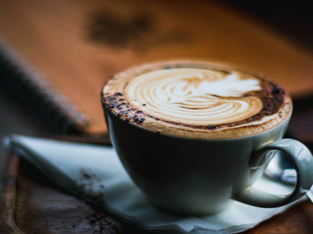 Mocha on a saucer with a spoon